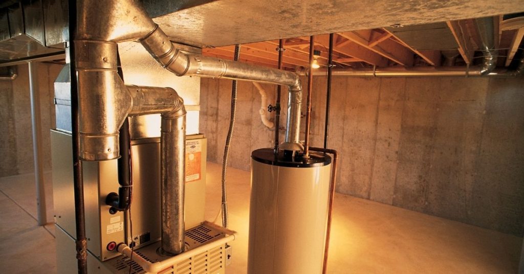 A hot water heater, gas furnace, and air conditioning unit.